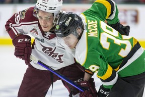 Chase Lefebvre of the Peterborough Petes knocks heads with London Knights player Max McCue during the first period of Game 2 of the OHL championship series at Budweiser Gardens in London on Saturday May 13, 2023. Derek Ruttan/The London Free Press