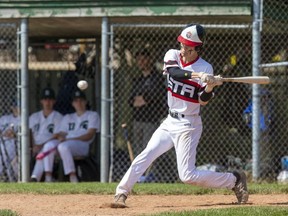 Owen Brown of St. Thomas Aquinas swings at a pitch during their TVRA co-ed baseball game against Mother Teresa at Aldridge Field in London on Monday May 15, 2023. (Derek Ruttan/The London Free Press)