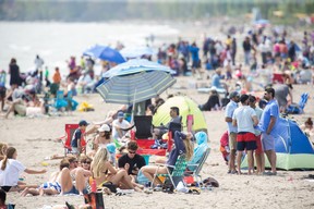 Hundreds of people enjoyed Port Stanley's beach on the unofficial first weekend of summer on Sunday.
