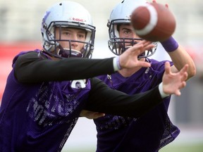 Defensive back Robert Panabaker, left, went in the fifth round of the CFL draft, 40th overall. (Free Press file photo)