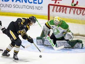 London Knights goalie Zach Bowen is locked in on Sarnia Sting puck-handler Nolan Burke, who would soon pass to Ty Voit for a goal in Game 4 of their OHL Western Conference championship series. Photo taken in Sarnia on Wednesday May 3, 2023. Mike Hensen/The London Free Press