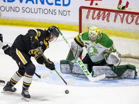 London Knights goalie Zach Bowen is locked in on Sarnia Sting puck-handler Nolan Burke, who would soon pass to Ty Voit for a goal in Game 4 of their OHL Western Conference championship series. Photo taken in Sarnia on Wednesday, May 3, 2023. (Mike Hensen/The London Free Press)