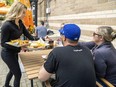 Emma Conley of Jack Astor’s in London serves customers on the patio on Friday, May 5, 2023. Statistics Canada said Friday the London area's unemployment rate of 4.4 per cent in April is the lowest on record. (Mike Hensen/The London Free Press)