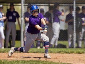 London Central secondary school’s Pedro Kriek reaches and connects for a hit during the Golden Ghosts’ game against the Clarke Road Trojans in TRVA high school baseball at Norm Aldridge Field in London on Tuesday May 9, 2023. (Mike Hensen/The London Free Press)