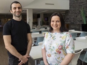 Lazo Meladze, left, fled Ukraine in 2022 and came to London, where he took part in a work-study program for Ukrainian refugees at Western University. He stands beside Svitlana Stoko-Hoto, a fellow Ukrainian refugee who started in the program and now is a housing co-ordinator at a student residence. Photo taken May 11, 2023. (Mike Hensen/The London Free Press)