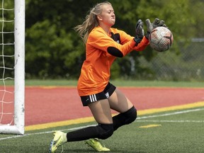 Bessette goalie Avery Mullen makes a save