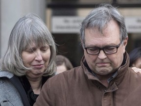 Clayton Babcock, right, stands next to his wife Linda as he reads a prepared statement outside court in Toronto on Saturday, December 16, 2017.