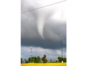 A funnel cloud appears in the sky near the Amazon plant in Talbotville, south of London, in the evening on Tuesday June 13, 2023. (Mike Hensen/The London Free Press)