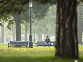 Grant MacDonald sits on a bench in Victoria Park