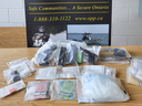 Ontario Provincial police seized drugs, cash and stolen police gear in Stratford and Mitchell raids on Wednesday July 12, 2023. (Police handout)