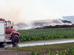 Firefighters battle a blaze at a farm in Bluewater on Airport Line between Exeter and Hensall in Huron County. Photo taken on July 10, 2023. (Scott Nixon/Postmedia Network)