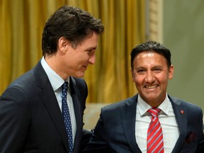 Minister of Justice and Attorney General of Canada Arif Virani poses for a photo with Prime Minister Justin Trudeau during a cabinet swearing-in ceremony at Rideau Hall in Ottawa, Wednesday, July 26, 2023.