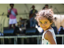 Sina Moneka, 3, of Toronto looks back as she walks to the stage where her father, Ahmed Moneka, was singing vocals for Moneka Arabic Jazz at Sunfest in London on Friday July 7, 2023. Mike Hensen/The London Free Press/ Postmedia Network