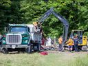 A homeless encampment adjacent to Victor Drive was dismantled in St. Thomas on Wednesday July 19, 2023. Derek Ruttan/The London Free Press