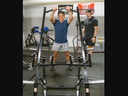 London Knights player Easton Cowan works out with a hammer press at TPH Training Centre under the tutelage of strength, speed and conditioning coach Trevor Williamson in London on Thursday, July 27, 2023. (Derek Ruttan/The London Free Press)