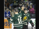 London Knights forward Mitch Marner high-fives teammate Max Domi after scoring a goal against the Windsor Spitfires during their OHL game at Budweiser Gardens in London on Friday January 16, 2015. (Free Press files)