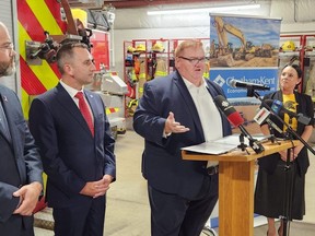 Minister of Natural Resources and Forestry Graydon Smith announces the province is providing an additional $11 million to Chatham-Kent to help its response to an explosion in Wheatley nearly years ago at a news conference at the Wheatley fire hall on Wednesday, Aug. 23, 2023.  Also shown are Coun. Aaron Hall, left, Chatham-Kent-Leamington MPP Trevor Jones and Coun. Lauren Anderson. (Trevor Terfloth/The Daily News)