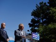 Ontario Premier Doug Ford says the province is looking to return land to the Greenbelt that a developer recently sold. Ontario's minister of housing Steve Clark listens as Ford speaks during a press conference in Mississauga, Ont., Friday, Aug. 11, 2023.