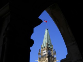The federal government says it is investigating allegations that a farm in southwestern Ontario sent six Jamaican seasonal workers home earlier than planned after they protested their living and working conditions. The Canadian flag flies on top of the Peace Tower on Parliament Hill in Ottawa on Monday, March 6, 2023.