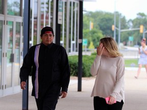 Delsin Johnson-Shipman, left, walks toward the Sarnia courthouse Thursday afternoon. He was sentenced to six years in prison Thursday for the triple-the-limit crash that killed Michelle White and Gretta Williams. (Terry Bridge/Sarnia Observer)