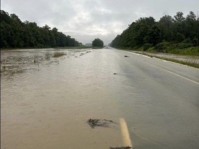 Highway 402 in Warwick Township was closed Wednesday because of flooding caused by as much as 175 millimetres of rain. (Warwick fire and rescue department/Facebook)
