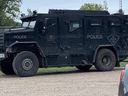An armoured OPP vehicle sits at the Port Burwell fire hall for what police at the scene called