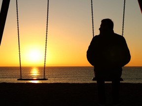 Man alone on swing