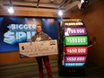 Brantford's Kyle Boutilier won $650,000 on the Bigger Spin lottery game with a ticket purchased at St. George and Grand Mart on St. George St.