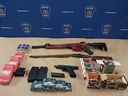 London police officers seized three firearms and hundreds of rounds of ammunition in a search of a home on Duchess Avenue on the weekend. (London police photo)