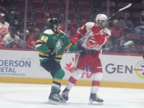 Soo Greyhounds captain Bryce McConnell-Barker, a London native, is tied up with London Knights defenceman Jackson Edward during first period OHL action at the GFL Memorial Gardens on Wednesday Oct. 4, 2023. (Gordon Anderson/Postmedia)