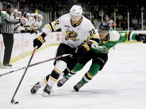 Sarnia Sting's Sandis Vilmanis (22) is chased by London Knights' Isaiah George (4) in the first period at Progressive Auto Sales Arena in Sarnia, Ont., on Saturday, Oct. 14, 2023. Mark Malone/Chatham Daily News/Postmedia Network