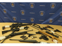 Guns and ammunition were seized in a London police raid on a north-end home on Tuesday Nov. 28, 2023. (Handout)