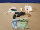 London police seized a handgun, hollow-point bullets, fentanyl and cash on Simcoe Street on Wednesday Dec. 20, 2023. A 19-year-old is charged. (Police handout)