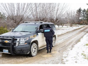 An Ontario Provincial Police officer is shown at 4022 Wardell Dr. near Strathroy on Friday January 12, 2024. Derek Ruttan/The London Free Press