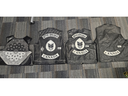 Police seized One Order outlaw motorcycle club vests, including two for the group's London chapter, along with guns during the search of a Brampton home on Jan. 11, 2024. (OPP supplied photo)
