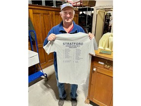 Rick Schwartzentruber, coach of the 2003-04 Stratford Jr. Warriors minor atom MD team, holds a T-shirt with the name of each player and coach, including Justin Bieber, who was captain. (Supplied)