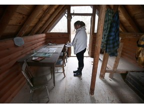 Twenty years later, families still haunted by memories. Meghan Souchuk, executive assistant at Kingsville's Jack Miner Bird Sanctuary, is shown Friday inside the Flight 126 Memorial Cabin. It was built to honour the memory of eight local hunters among the 10 who died in a plane crash off Pelee Island on Jan. 17, 2004.