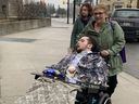 Tristan Roby and his mother Abby arrive at a London court for Jesse Black's sentencing hearing, Thursday, Feb. 1, 2024. Black was found guilty of failing to remain at the scene of a car accident and driving offences following the July 21, 2019, crash that left Roby confined to a wheelchair. (Jane Sims/London Free Press)