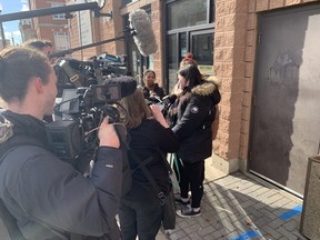 Meagan Stanley, right, faced microphones and cameras outside Brantford's Ontario Court of Justice Wednesday as she expressed her disappointment at the house arrest sentence handed down for doula-scammer Kaitlyn Braun.