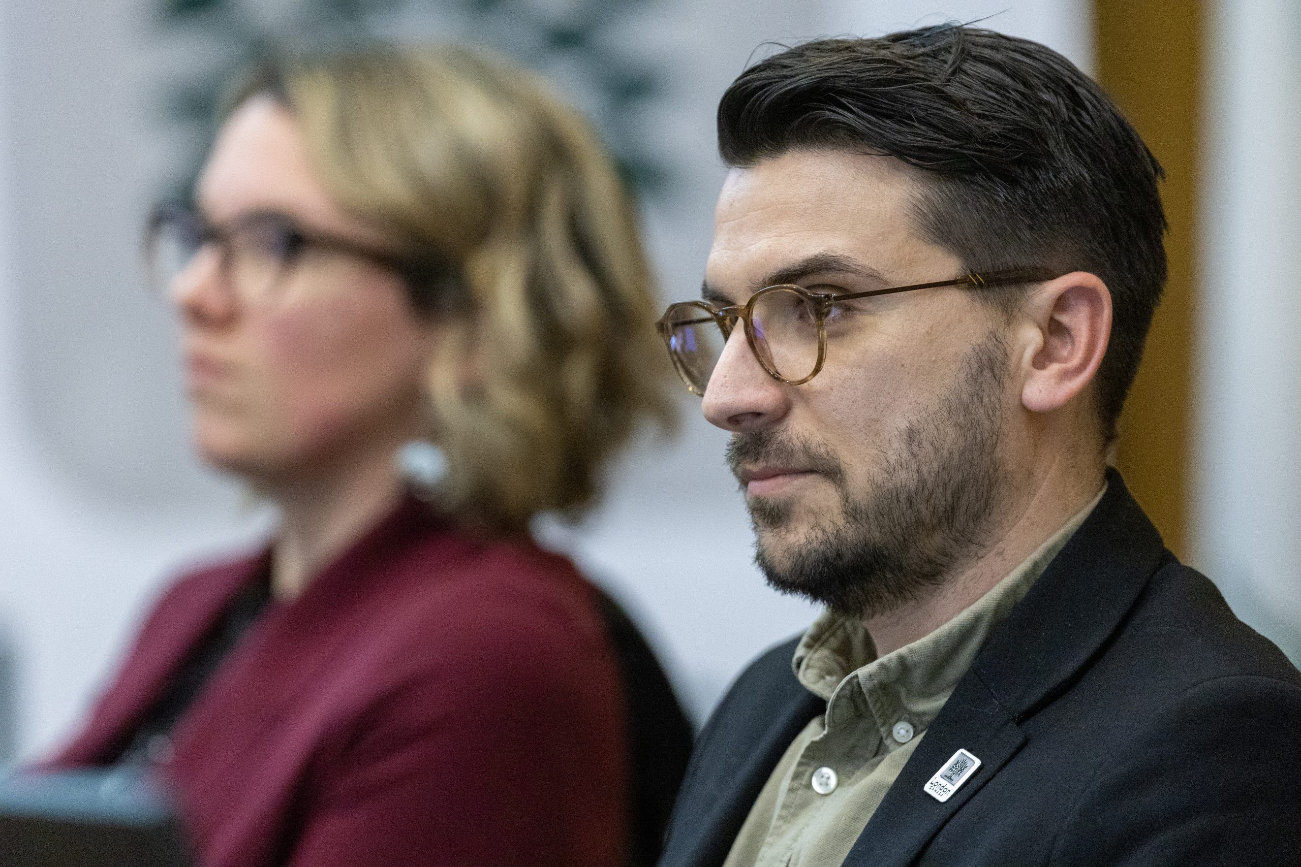 Ward 13 Coun. David Ferreira and Ward 11 Coun. Skylar Franke listen during budget talks at city hall in London on Thursday February 8, 2024. (Derek Ruttan/The London Free Press)
