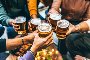 toasting glass of beer at brewery pub