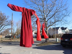 Red dresses, symbols of missing and murdered Indigenous women and girls, hang on Wednesday Feb. 15, 2024 outside the Sarnia-Lambton Native Friendship Centre.