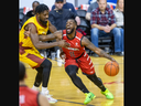 Chris Jones of the London Lightning is fouled by Anthony Ottley of the Newfoundland Rogues during their Basketball Super League game at Budweiser Gardens in London on Friday March 1, 2024. Derek Ruttan/The London Free Press/ Postmedia Network