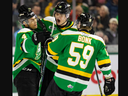 Kaleb Lawrence and Oliver Bonk of the London Knights congratulate Isaiah George after he scored his first OHL playoff goal in Game 2 of their Ontario Hockey League playoff series against the Flint Firebirds at Budweiser Gardens in London on Sunday, March 31, 2024. (Mike Hensen/ The London Free Press)