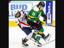 Nathan Gaymes of the Windsor Spitfires collides with Ryder Boulton of the London Knights during their Ontario Hockey League game at Budweiser Gardens in London on Friday March 22, 2024. Derek Ruttan/The London Free Press/Postmedia Network