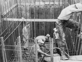 Workers are shown preparing the site for a pumping station in Dresden in 1957. The pit later caved in, claiming six lives. (Supplied)