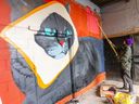 Nick Sweetman paints a mural on a loading dock just west of the Adelaide Street-Hamilton Road intersection in London, part of the public-art efforts by a group calling itself the Risky Play Collective. Photo taken on Wednesday April 17, 2024. (Mike Hensen/The London Free Press)