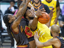 Freddie McSwain of the London Lightning fights off three members of the St. Louis Griffins as he recovers a rebound during their game at Budweiser Gardens in London on Friday April 12, 2024. Derek Ruttan/The London Free Press