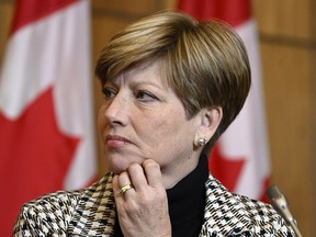 Elgin-Middlesex-London Conservative MP Karen Vecchio listens during a news conference in Ottawa on Tuesday, Nov. 22, 2022. (Canadian Press)