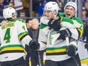 William Nicholl leaps onto the back of Sam Dickinson as the London Knights celebrate their OHL playoff series-clinching victory over the Kitchener Rangers at the Auditorium in Kitchener on Thursday April 18, 2024. The Knight won the game 4-3 and the series 4-0. (Derek Ruttan/The London Free Press/Postmedia Network)